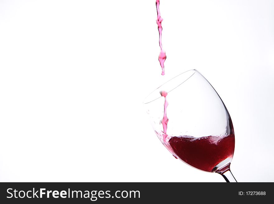 Full glass of red wine isolated on white background