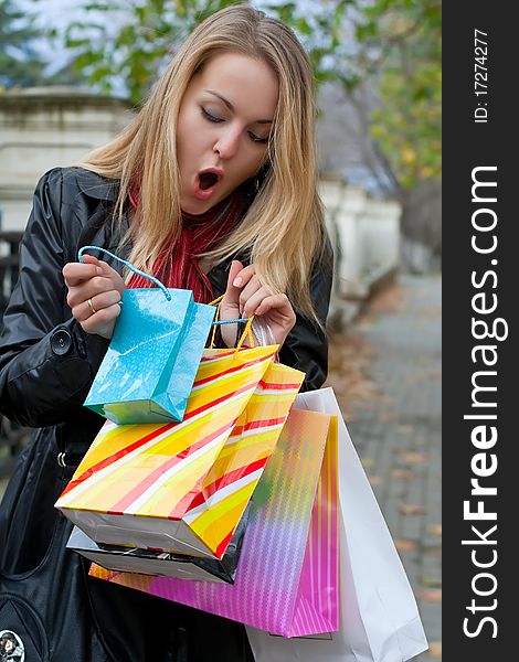 Autumn shopping. Fashion woman with bags. Autumn shopping. Fashion woman with bags