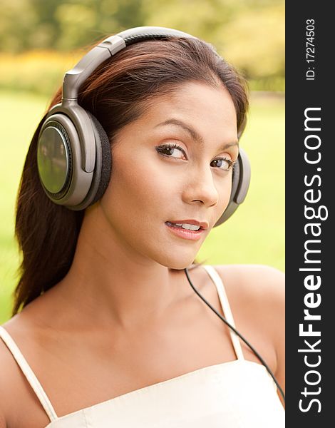 Young lady listening to music. Young lady listening to music