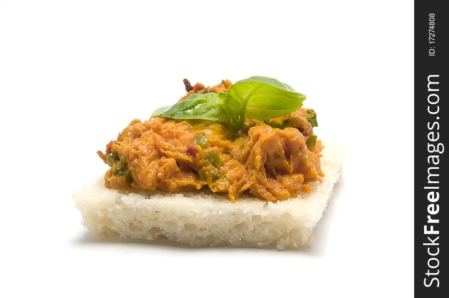 Slice of bread with minced meat and leaves of basil. Slice of bread with minced meat and leaves of basil