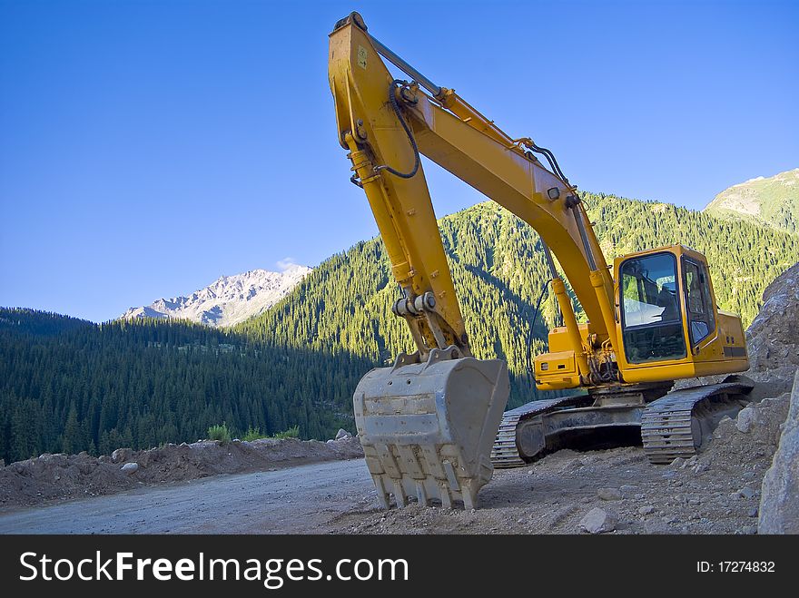 Big excavator or digger on a building site