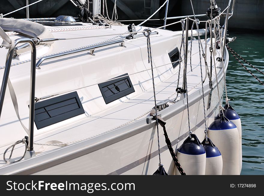 A White Yacht In Harbor