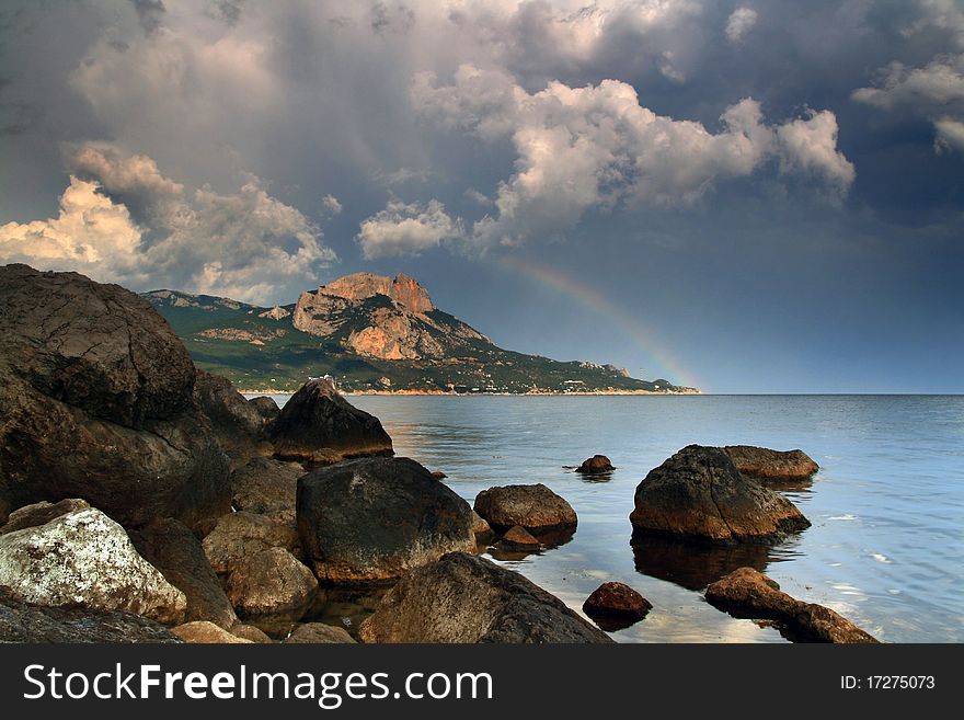 On the horizon was rain, sun illuminated it, and created this miracle - the dawn rainbow. On the horizon was rain, sun illuminated it, and created this miracle - the dawn rainbow