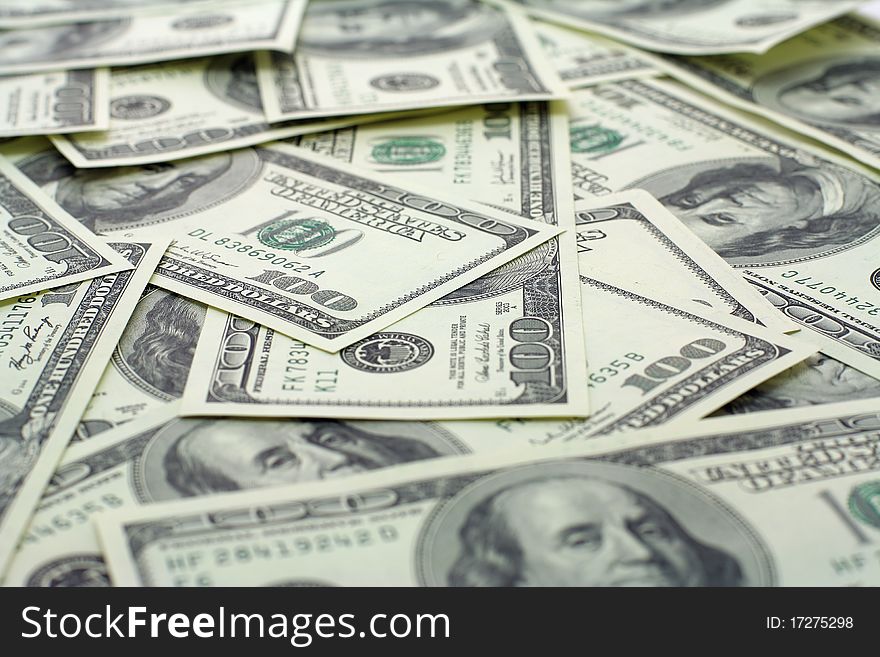 Hundred dollars banknotes background with depth of field. Hundred dollars banknotes background with depth of field