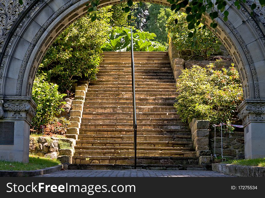 Archway to sunlit stairs