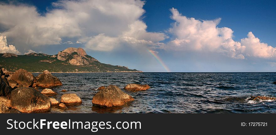 On the horizon was rain, sun illuminated it, and created this miracle - the dawn rainbow. On the horizon was rain, sun illuminated it, and created this miracle - the dawn rainbow