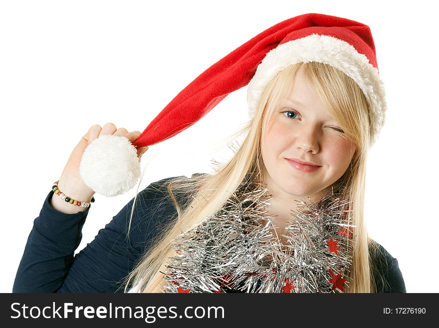 A beautiful young blonde in a Santa hat on a white background