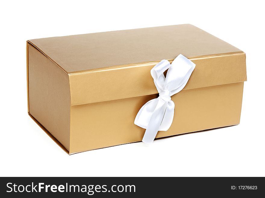 Golden gift box with a bow on a white background