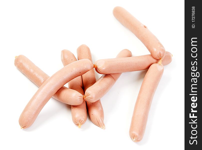 Pile of raw sausages on white background