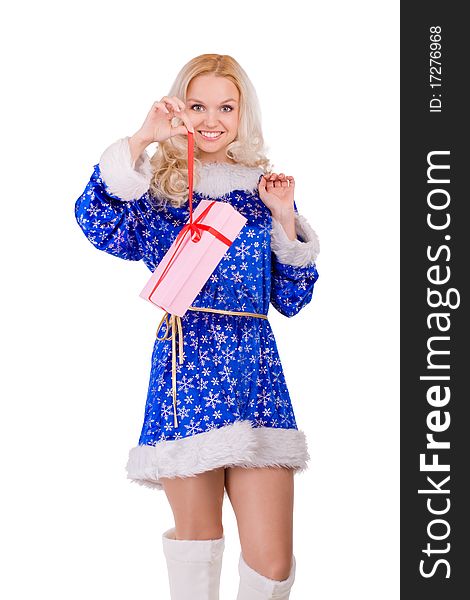 Portrait of a beautiful girl in a Christmas costume with a gift in hand. Portrait of a beautiful girl in a Christmas costume with a gift in hand
