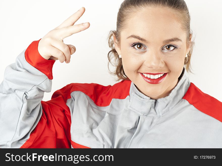 Young happy woman wearing mechanics overalls uniform