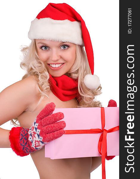 Portrait of a beautiful girl in a Santa hat and gloves with a gift in hands. Portrait of a beautiful girl in a Santa hat and gloves with a gift in hands