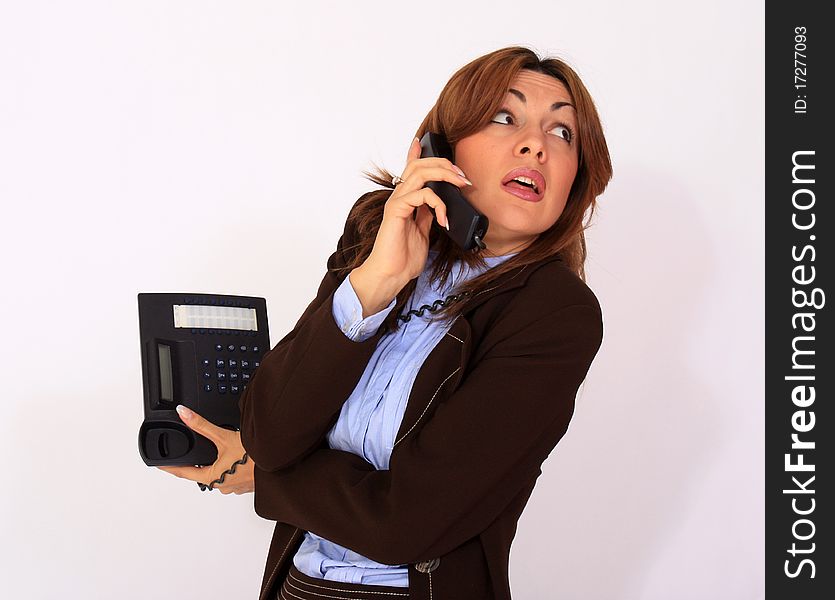 Attractive secretary talking on the cell phone