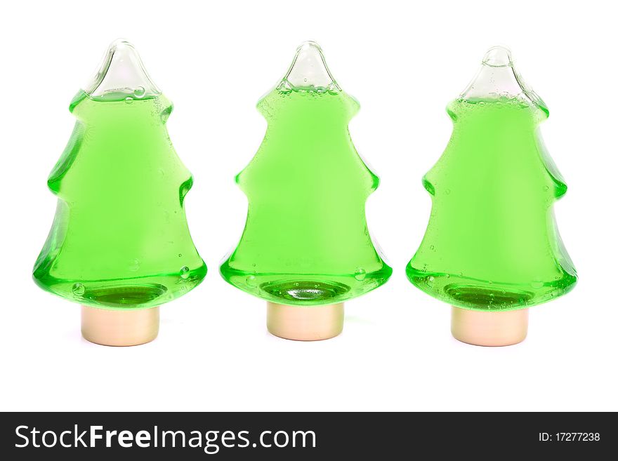 Three green shampoo in a bottle in the shape of a Christmas tree