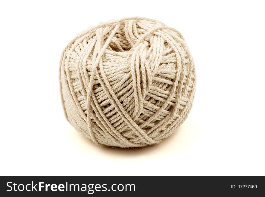 A ball of white string. Isolated on white. A ball of white string. Isolated on white.