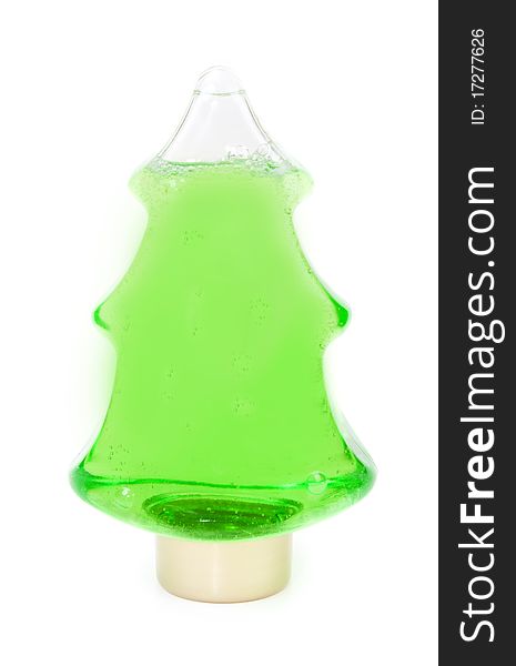 Green shampoo in a bottle in the shape of a Christmas tree