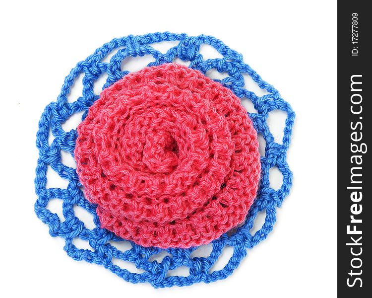 Knitted roses of red and blue thread