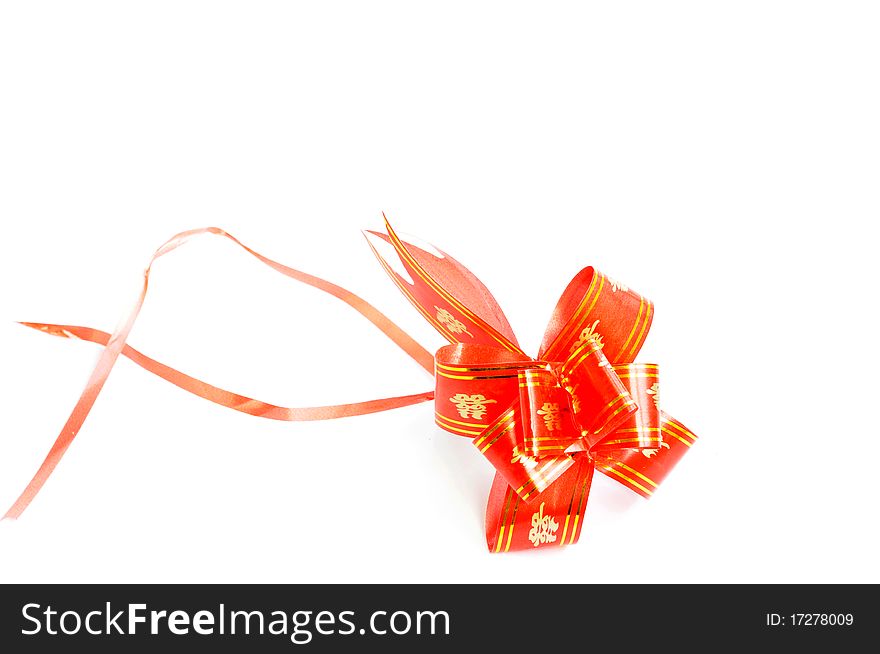 Chinese red auspicious knot isolated on a white background,used for the decorations of wedding invitation cards or new year cards.Blank for text.