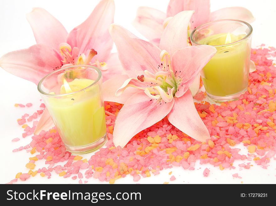 Pink lilies and green candles. Pink lilies and green candles