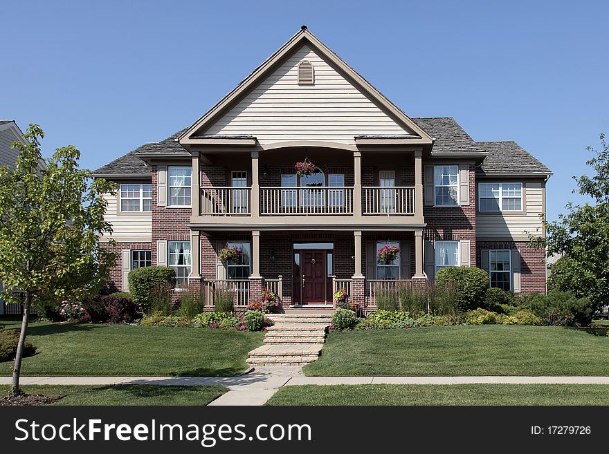 Brick Home With Front Balcony