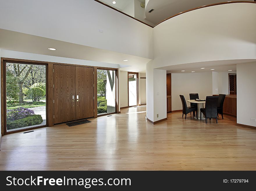 Foyer in luxury home with rounded second floor landing