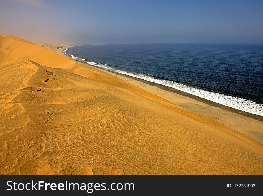 Sand Dunes and Ocean near Walvis Bay, Namibia. Sand Dunes and Ocean near Walvis Bay, Namibia