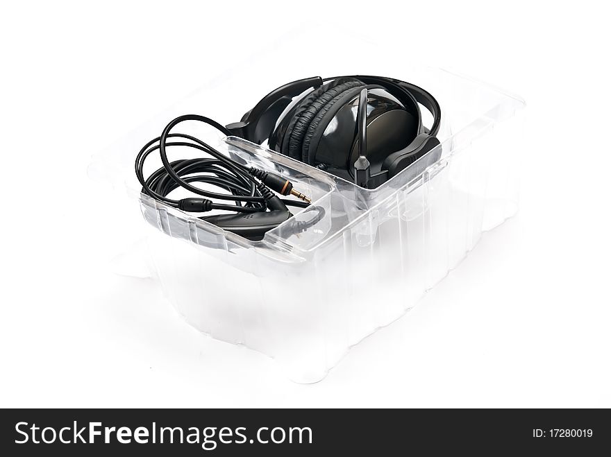 Black headphones in box isolated on white background