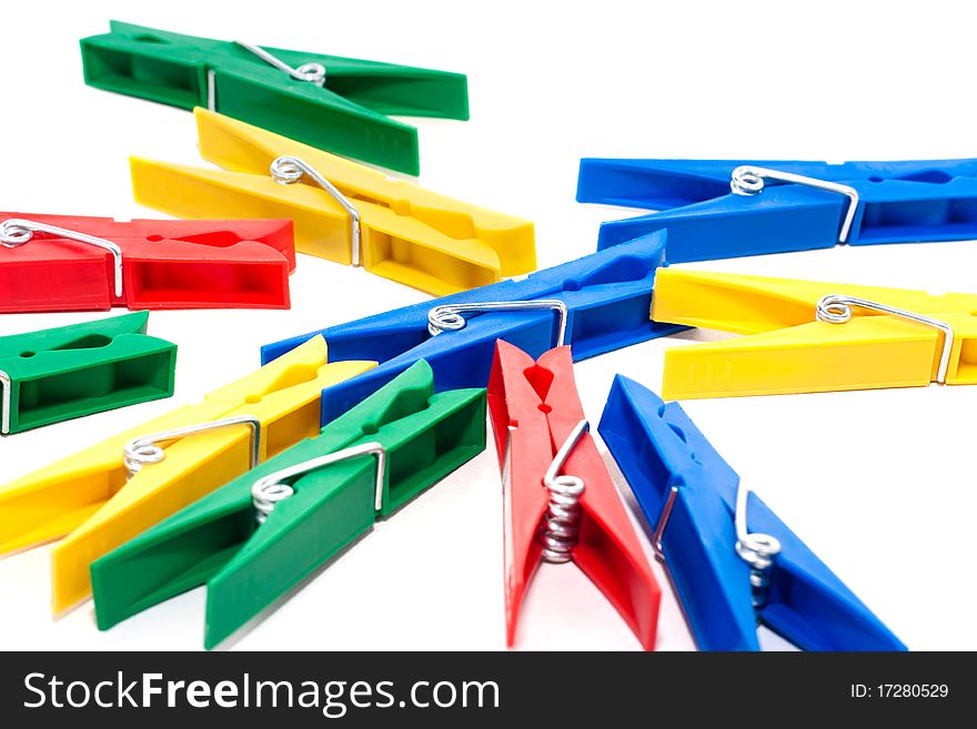 Many colored clothespin isolated on white background