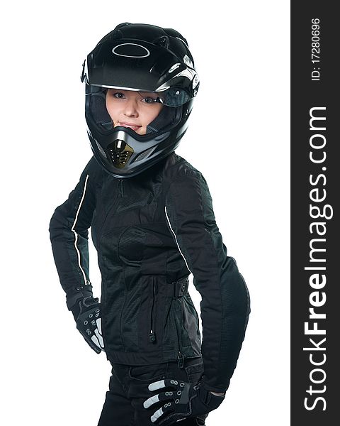 Young woman posing in black motorcycle clothing and helmet. Isolated on white. Young woman posing in black motorcycle clothing and helmet. Isolated on white.