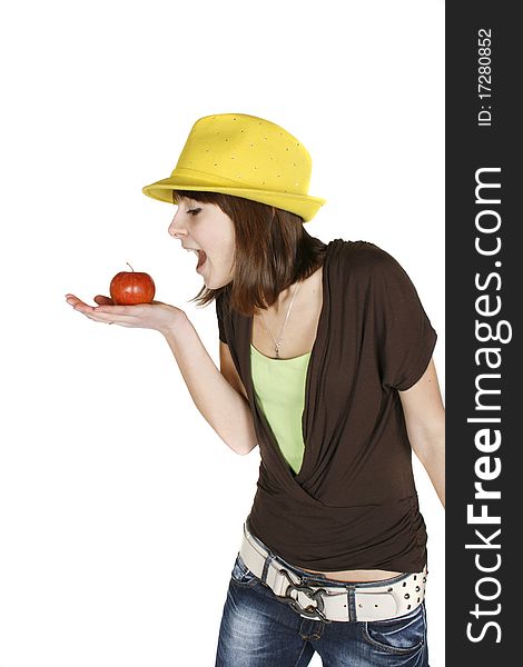Beautiful girl eating an apple - isolated over white. Beautiful girl eating an apple - isolated over white