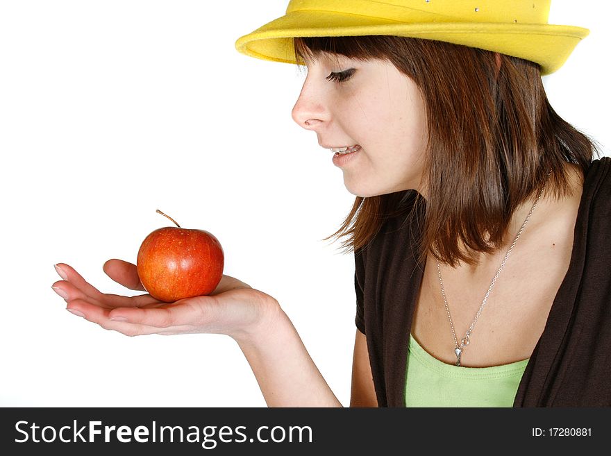 Beautiful girl looking at apple - isolated over white. Beautiful girl looking at apple - isolated over white