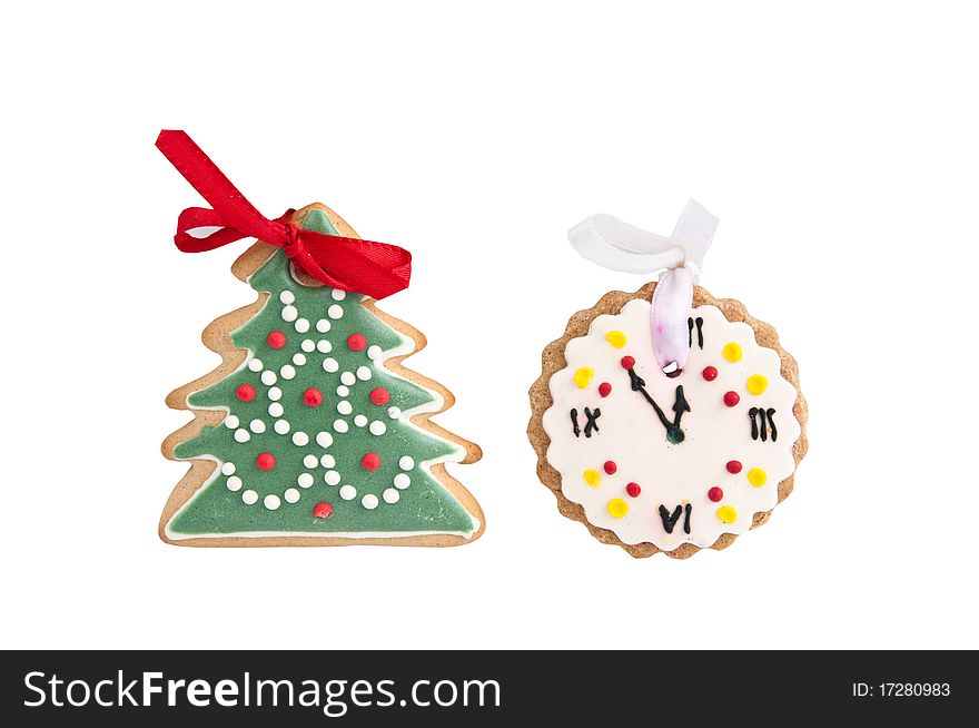 Cookies in the shape of Christmas hours on a white background. Cookies in the shape of Christmas hours on a white background