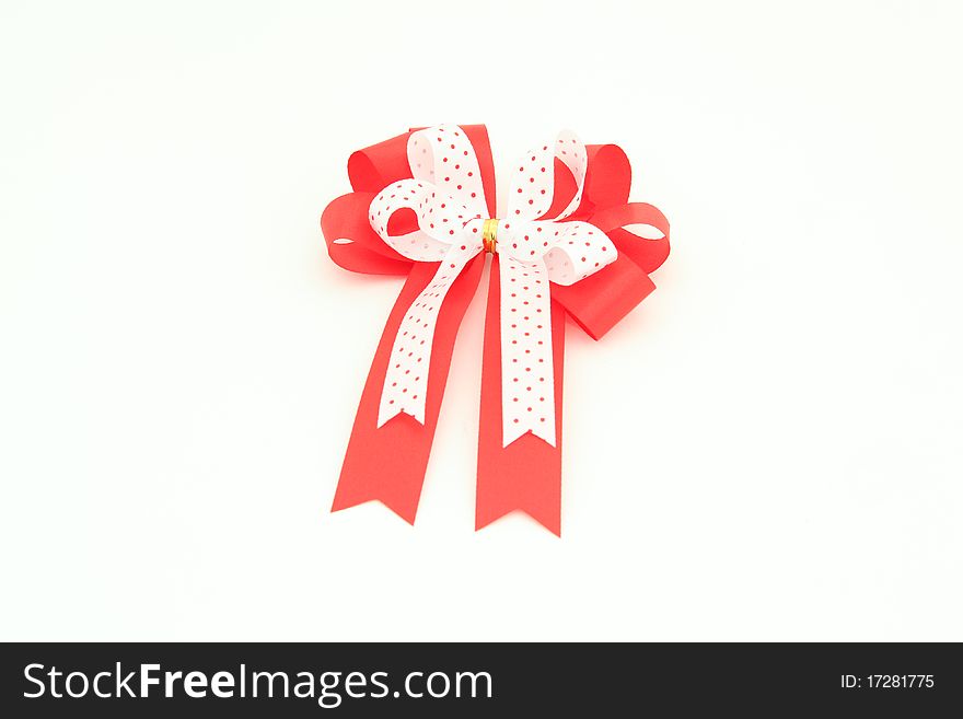 Red And White Bow For Holiday Gift Box Over White