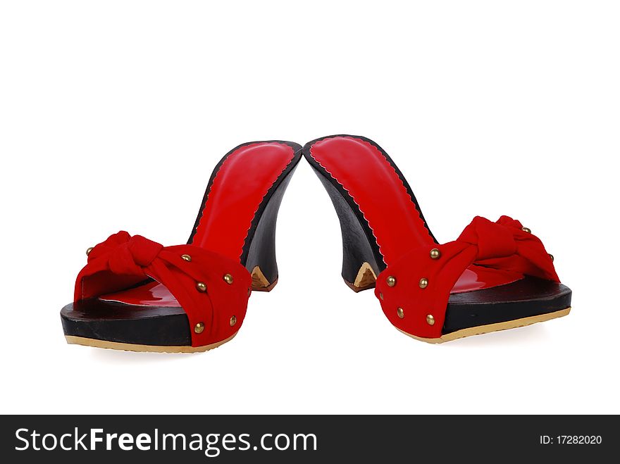 This is a beautiful red and black ladies shoes isolated on a white background. This is a beautiful red and black ladies shoes isolated on a white background.