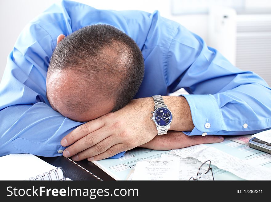 Businessman sleeping in the office