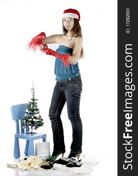 Girl wear Santa hat holding a decoration. Girl wear Santa hat holding a decoration