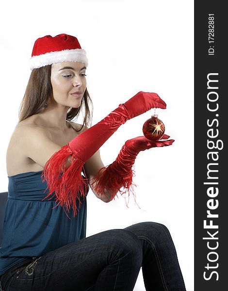 Girl wear Santa hat holding a decoration. Girl wear Santa hat holding a decoration