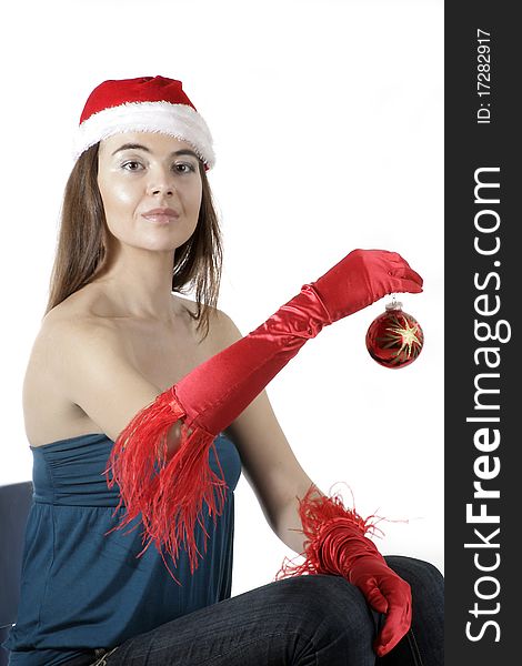 Girl wear Santa hat holding a decoration. Girl wear Santa hat holding a decoration