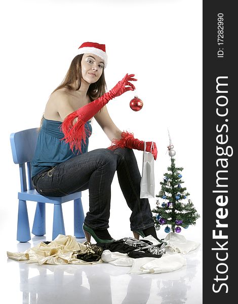 Girl wear Santa hat holding a decoration. Girl wear Santa hat holding a decoration