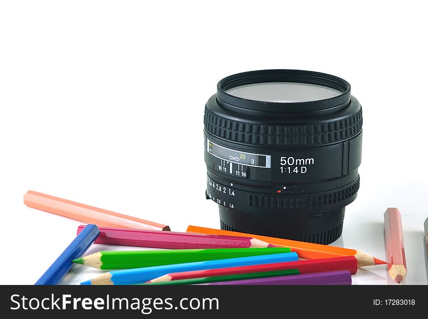 Illustration of camera lens and color pencils on white background