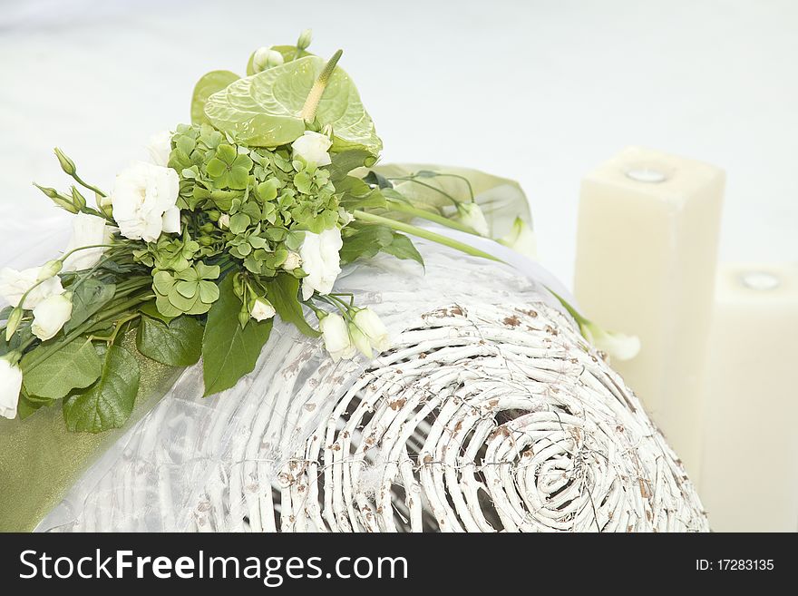 Wedding decoration. Green plants on a white basket