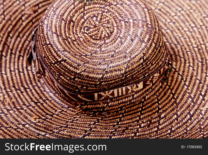 Brown and beige straw hat. Close up background