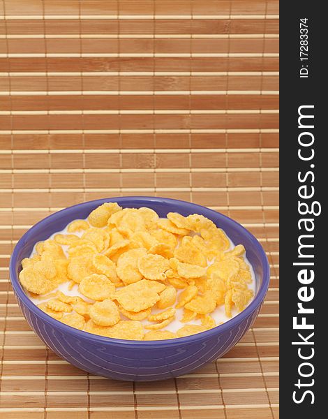 Cornflakes with milk in a bowl