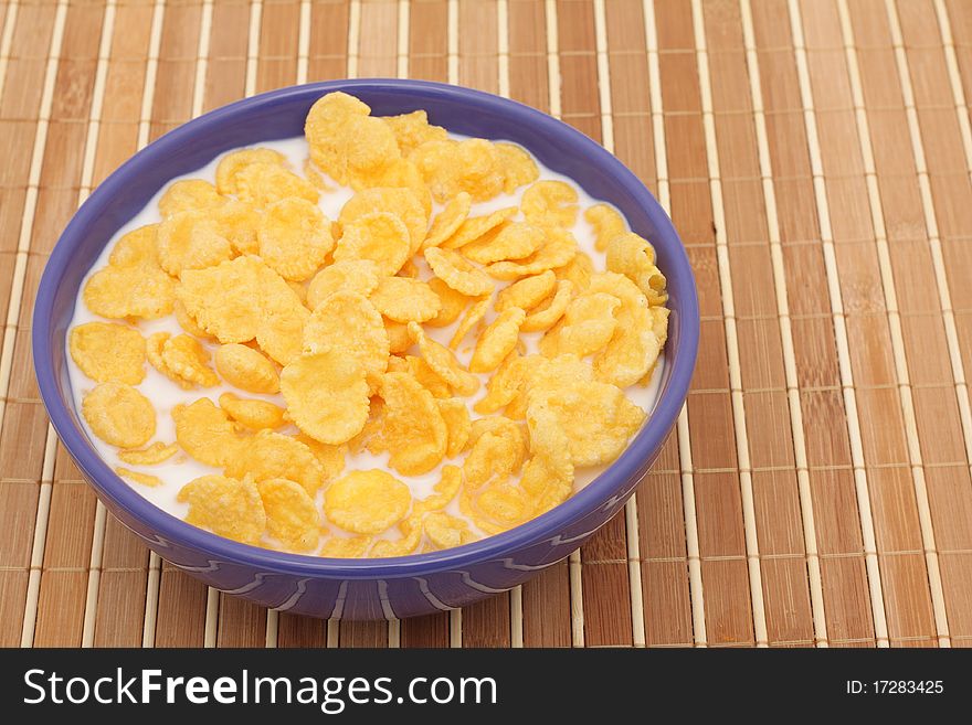 Cornflakes with milk in a bowl