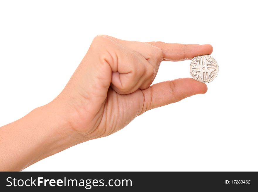 Hand holding a coin over white background