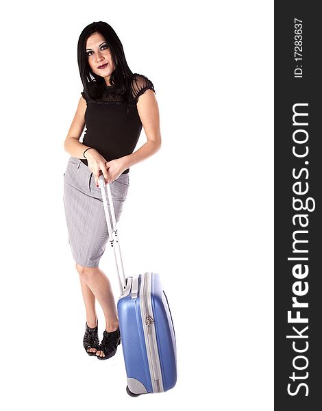 A woman getting ready to go some where with her suit case in hand. She has a happy expression on her face. A woman getting ready to go some where with her suit case in hand. She has a happy expression on her face.