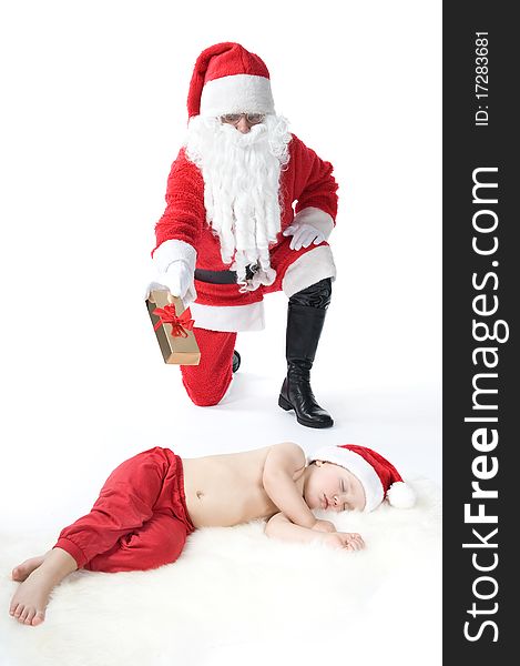 Baby and santa claus in studio. Baby and santa claus in studio