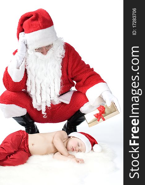 Santa Is Giving Gift To Sleeping Baby