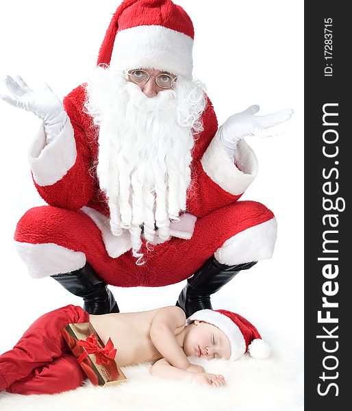 Santa Is Giving Gift To Sleeping Baby