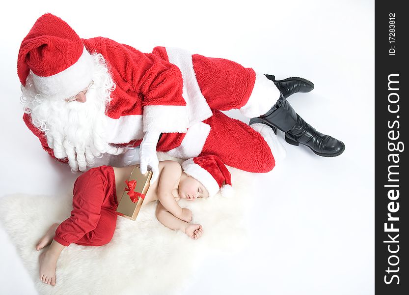 Santa Is Giving Gift To Sleeping Baby